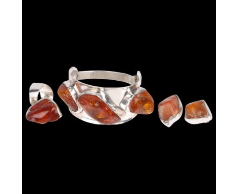 A Danish sterling silver and Baltic amber jewellery set, comprising torque bangle, ring and pair of clip-on earrings, bangle 