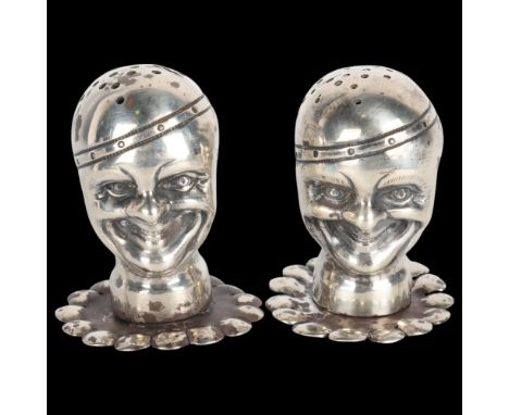 A pair of late Victorian novelty silver 'Pierrot Clown' pepperettes, Grey & Co, Birmingham 1896, registration no. 712390, 5cm