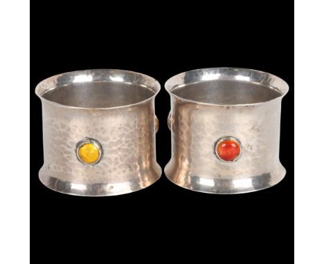 A pair of Arts and Crafts Edwardian silver and enamel napkin rings, Albert Edward Bonner, London 1907, flared cylindrical for