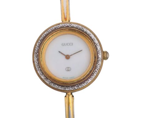 GUCCI - a lady's Vintage gold plated stainless steel quartz bangle wristwatch, ref. 1100-L, white dial with pencil hands, GG 