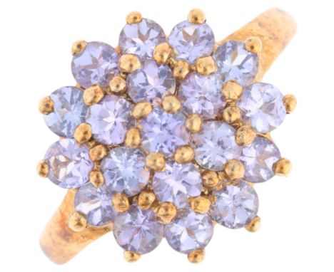 A 9ct gold tanzanite cluster ring, setting height 13.4mm, size K, 2.7gNo damage or repair, all stones present, full UK hallma