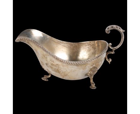 An Elizabeth II silver sauce boat, Barker Ellis, Birmingham 1967, bulbous form with gadrooned rim, acanthus leaf handle and h