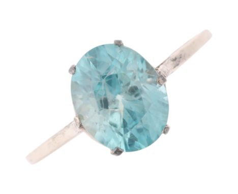 An Antique silver single stone blue zircon ring, set with oval mixed-cut zircon, setting height 9.4mm, size O, 1.8gZircon has
