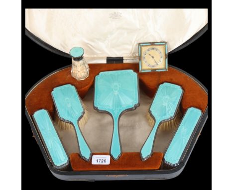 An Art Deco George V silver and teal enamel 7-piece dressing table set, William Comyns & Sons, London 1928, comprising 8-day 