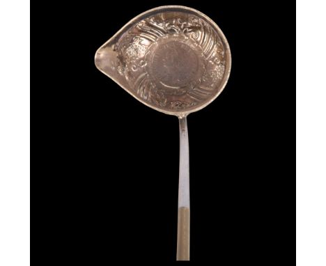 A George II silver toddy ladle, with 1758 coin inset bowl and twisted whale baleen handle, 35cmNumerous light dents to bowl, 