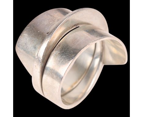LIV THURLWELL - a modernist sterling silver wrap-around band ring, setting height 16mm, size P, 9.4gNo damage or repair, only