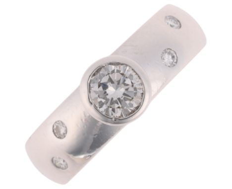 An 18ct white gold 0.4ct single-stone diamond band ring, maker CJ Ltd, London 1994, rub-over set with 0.4ct modern round bril