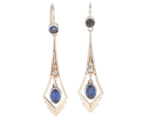 A pair of Art Deco 18ct white gold and platinum sapphire and diamond drop earrings, geometric pendant openwork form, millegra