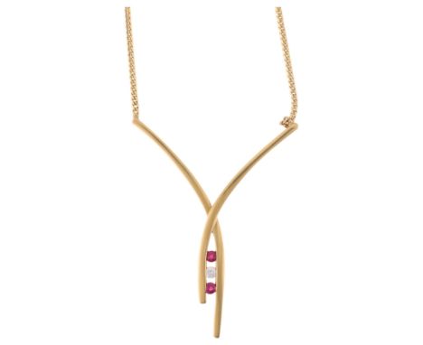 A 9ct gold ruby and diamond crossover pendant necklace, on integral 9ct serpentine link chain, pendant 44.1mm, 44cm, 4.7gNo d