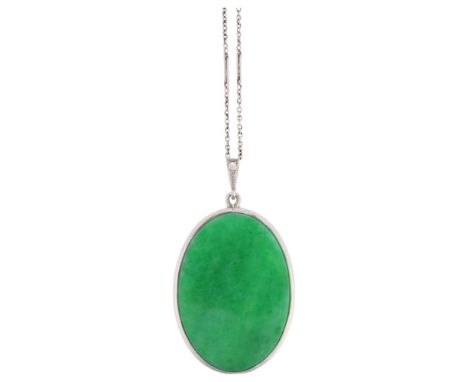 An Art Deco jade and diamond panel pendant necklace, set with polished oval flat-top jade plaque, within platinum frame havin