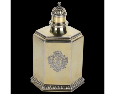 A fine George V silver-gilt tea caddy, William Comyns, London 1914, in the Queen Anne style, hexagonal form with relief embos