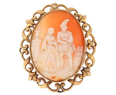 A large Victorian 9ct gold shell cameo brooch, the panel relief carved depicting Renaissance couple within landscape surround