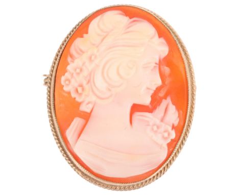 A Vintage 9ct gold shell cameo brooch, Birmingham 1983, relief carved depicting female profile, 32.6mm, 6.9gNo damage or repa