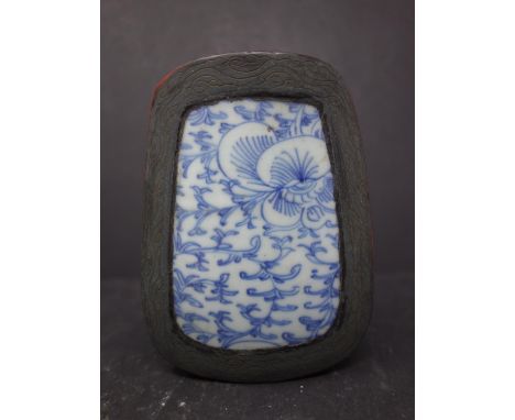 A small Chinese wood polychrome box with an antique Ming ceramic fragment set into the lid 110mm x 90mm 