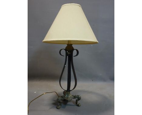 An Empire style wrought iron and brass lamp, with griffin paw feet and shade, H.83cm 