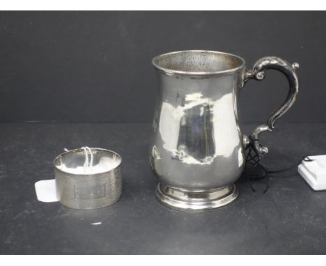 A small silver jug and a napkin ring, hallmarked,... 