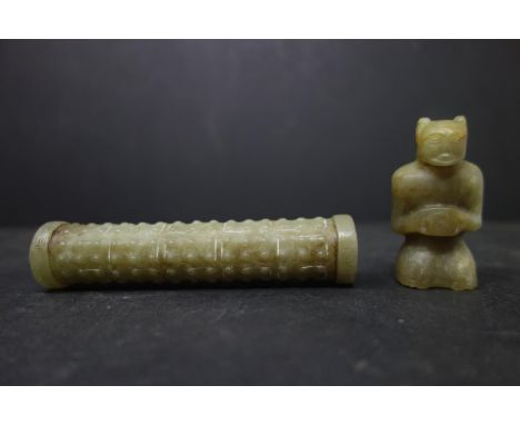 Two small Chinese jade carvings of a figure and a scroll, 19th century, approx. H.7 cm 
