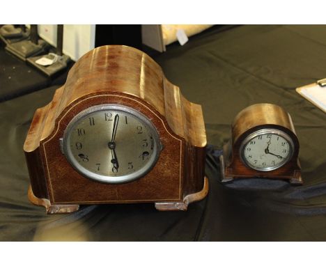 Mahogany mantel clock, the arched case with bone effect inlay, the silvered dial with Arabic numerals and Westminster/Whittin