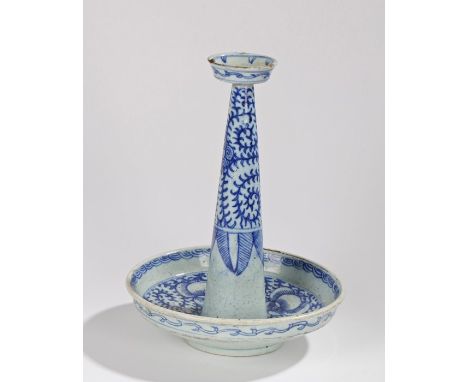 Chinese blue and white porcelain pricket candlestick, the dished sconce above a tapering stem and dished base, with stylised 