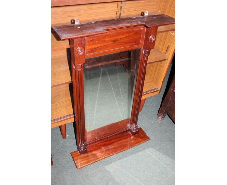 Mahogany wall mirror, the pediment above an arrow marquetry inlaid panel, the bevelled mirror plate flanked by turned pilaste