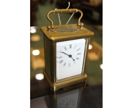 French brass carriage clock, with a white enamel dial 