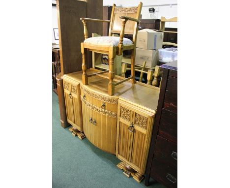 Mid 20th century oak sideboard, the bow front centre with frieze drawer and two cupboard doors, flanked by two cupboard doors