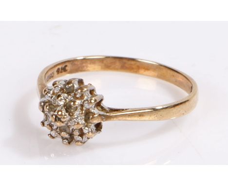 9 carat gold ring, with a flower head design, ring size K