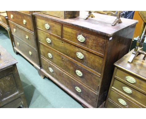 George III mahogany and ebony strung chest of two short and three long drawers, the brass handles with acanthus leaf backplat