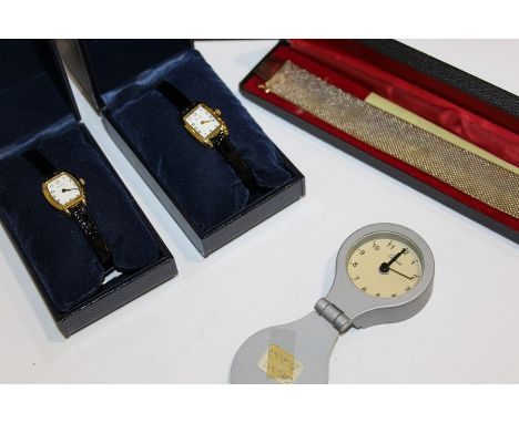 Two Sekonda ladies gold plated wristwatches, together with a gold plated bracelet and a folding desk/travel clock (4)