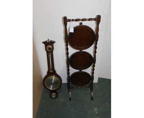 Oak cased aneroid barometer together with a 20h Century oak cake stand (2)