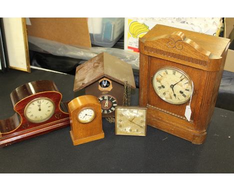 Collection of clocks, to include four desk clocks with Roman and Arabic numerals and a cuckoo clock (5)