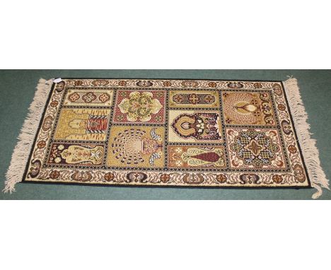 Prado Orient Keshan Super wool carpet, the cream ground ground scroll decoration and tasselled ends, 70cm x 140cm