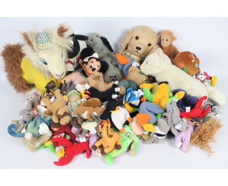 A collection of soft toys to include Ty Beanies, Sooty &amp; Sweep hand puppets, Applause Minnie Mouse and similar.