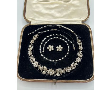 A late 19th / early 20th century, metamorphic diamond tiara. Converting into a tiara, earrings, necklace. With fitted box, ha