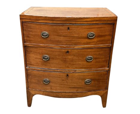 A Small Regency light coloured mahogany bow front chest of 3 long graduated drawers, 74cm wide