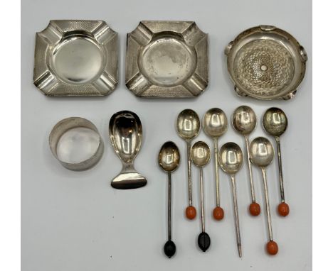 A collection of sterling silver items, ashtrays, caddy spoon, coffee spoons, napkin ring etc. Various dates and makers. 197g