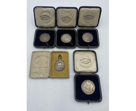 A collection of five sterling silver athletics medals 1920/30s. to KW Hancock. 66g. Four in fitted cases, one in original box