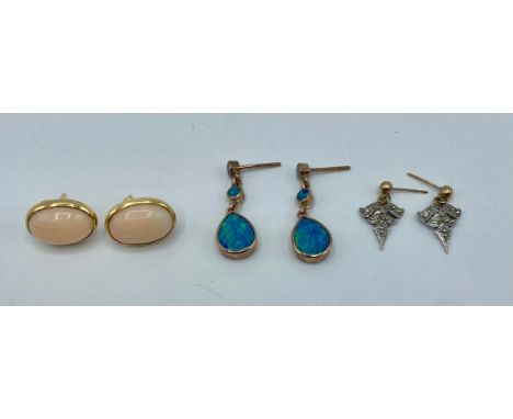 A pair of 18ct gold ear rings together with a a pair of unmarked yellow metal and black opal doublet ear rings and one other 