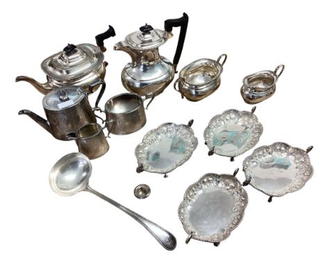 A collection of silver plated wares to include a set of four sweet meat dishes, two tea sets and a ladle.
