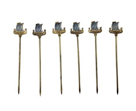 Manner of Askel Holmson Norway a set of six gilt silver and enamel cocktail sticks topped by Viking long ships, marked 925s w