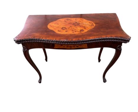 A French inlaid mahogany serpentine foldover card table with concertina action, on slender cabriole legs, 94cm wide x 73cm hi