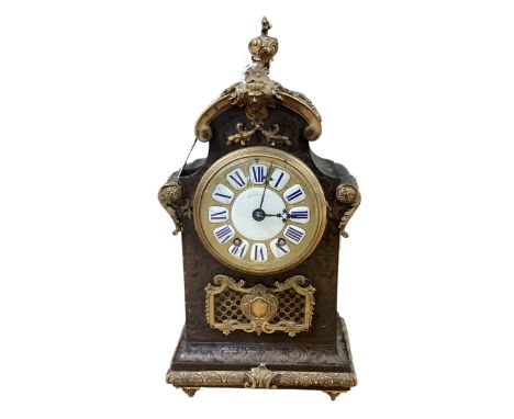 A Howell and Sons Boulle work mantle clock. Gilt and enamel faced marked J Howell and Co Paris  with numbered movement striki