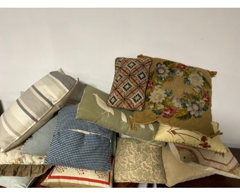 A quantity of cushions, to include tapestry ones, all as found