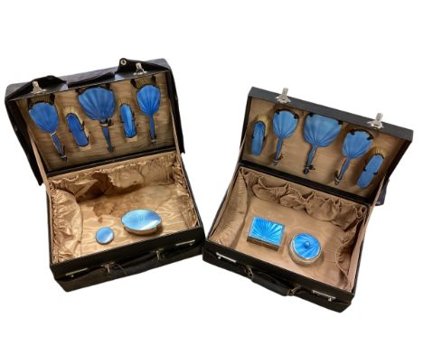 Two Ladies leather travel dressing cases with sterling silver and guilloche enamel fittings, silk lined(some staining to one)