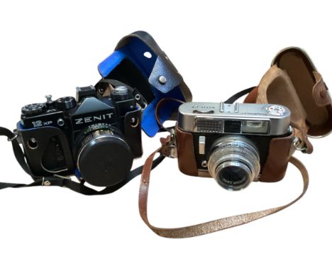 Two Vintage cameras. A Voigtlander VIto CL and a Zenit. 