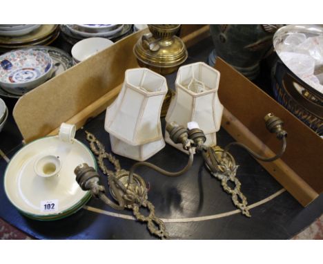 A pair of wall brackets with shades, an oil lamp, a mantel clock etc 