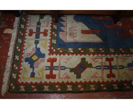 A Turkish style carpet 335 x 220cm 