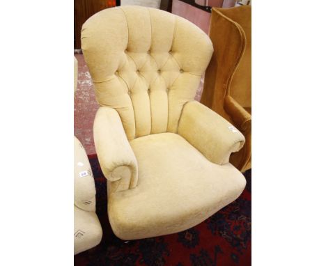 A Victorian style button back armchair