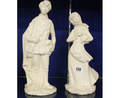 A pair of ceramic figures of a girl and boy each with a lamb, 30cm high and 35cm high