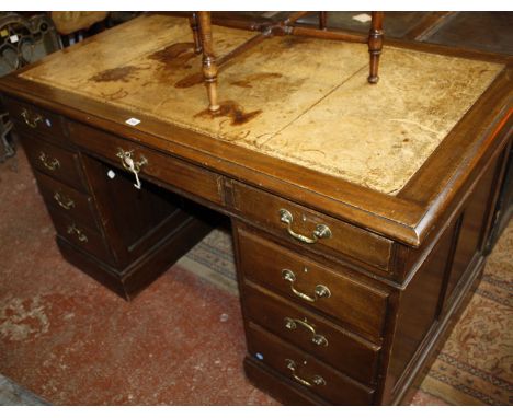 A George III style mahogany pedestal desk, with leather lined top and nine drawers, 137cm long